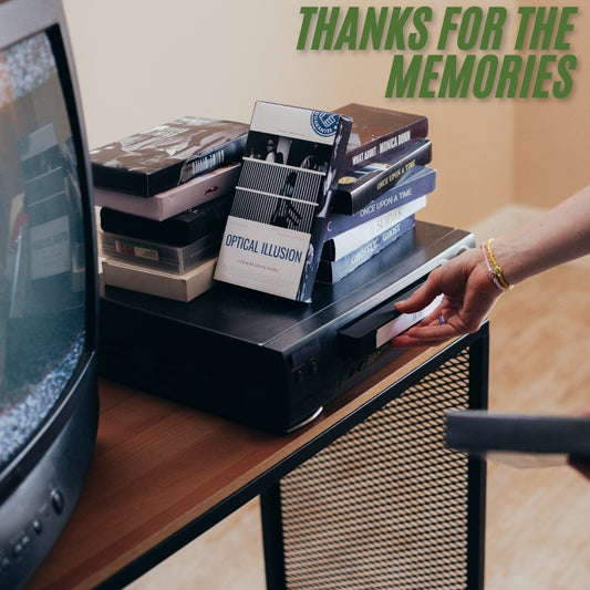 video cassette being loaded into a vhs player