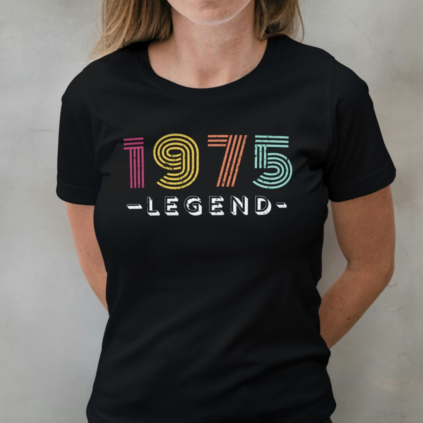 Woman wearing 1975 legend graphic tee
