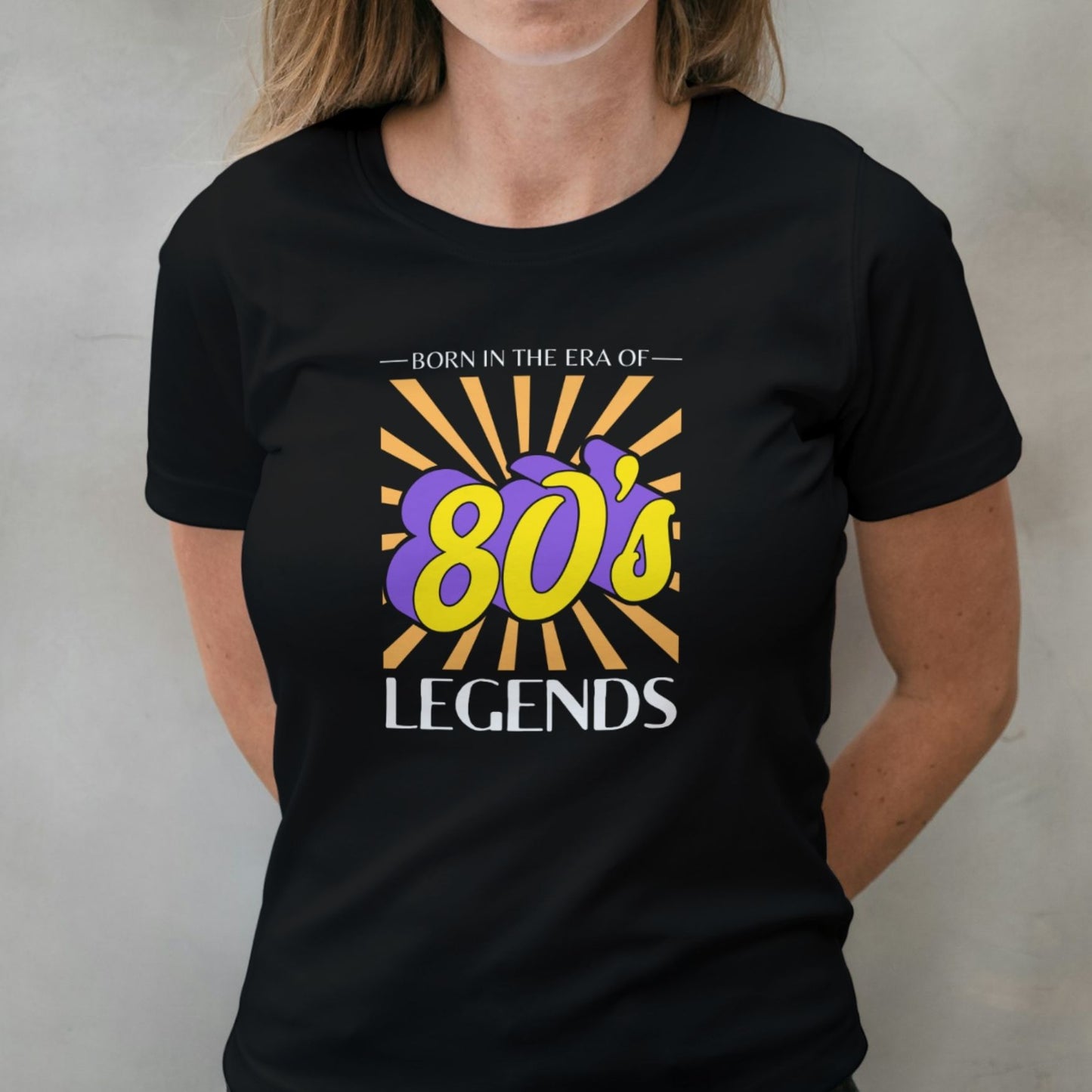 woman wearing 80s legend graphic tee