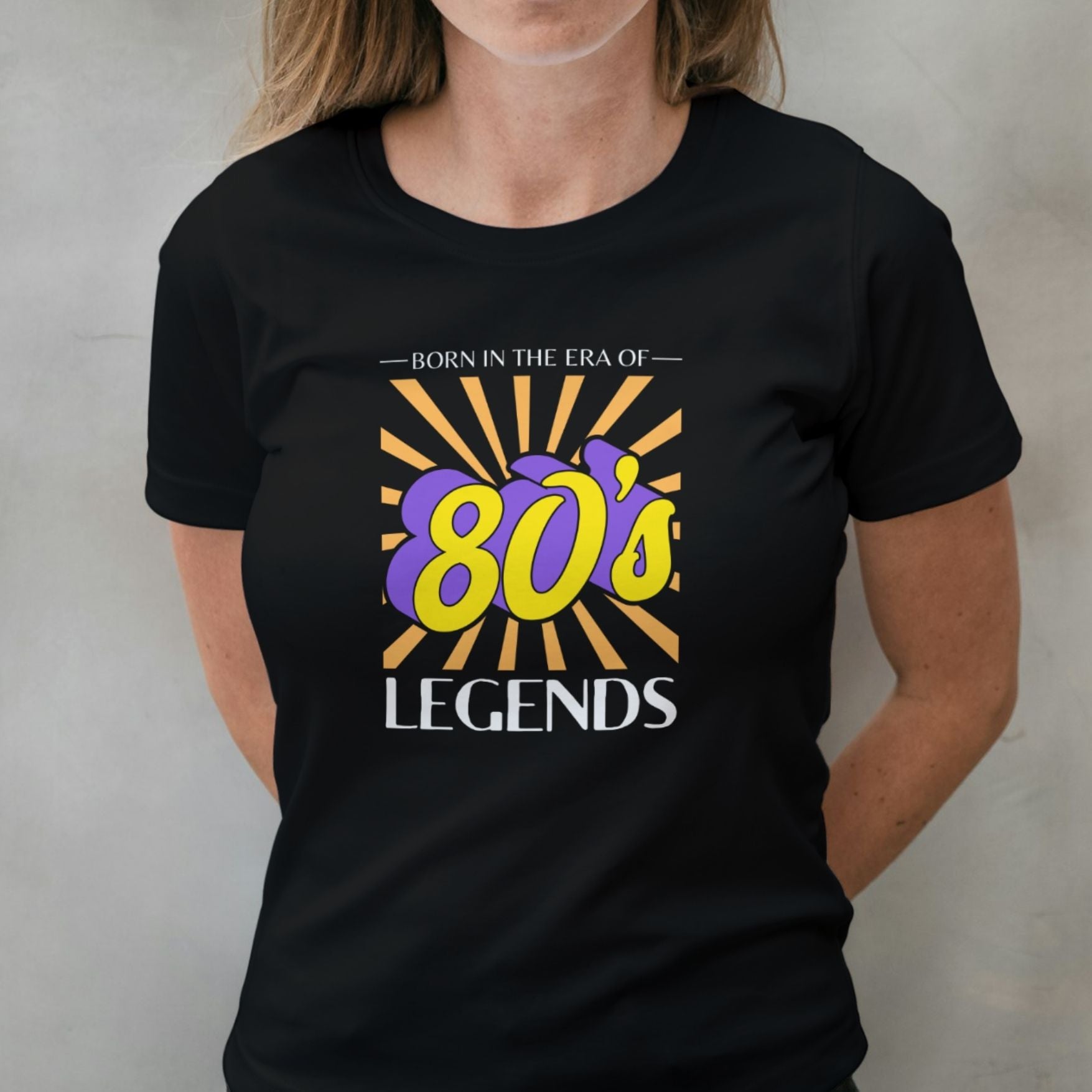 woman wearing 80s legend graphic tee