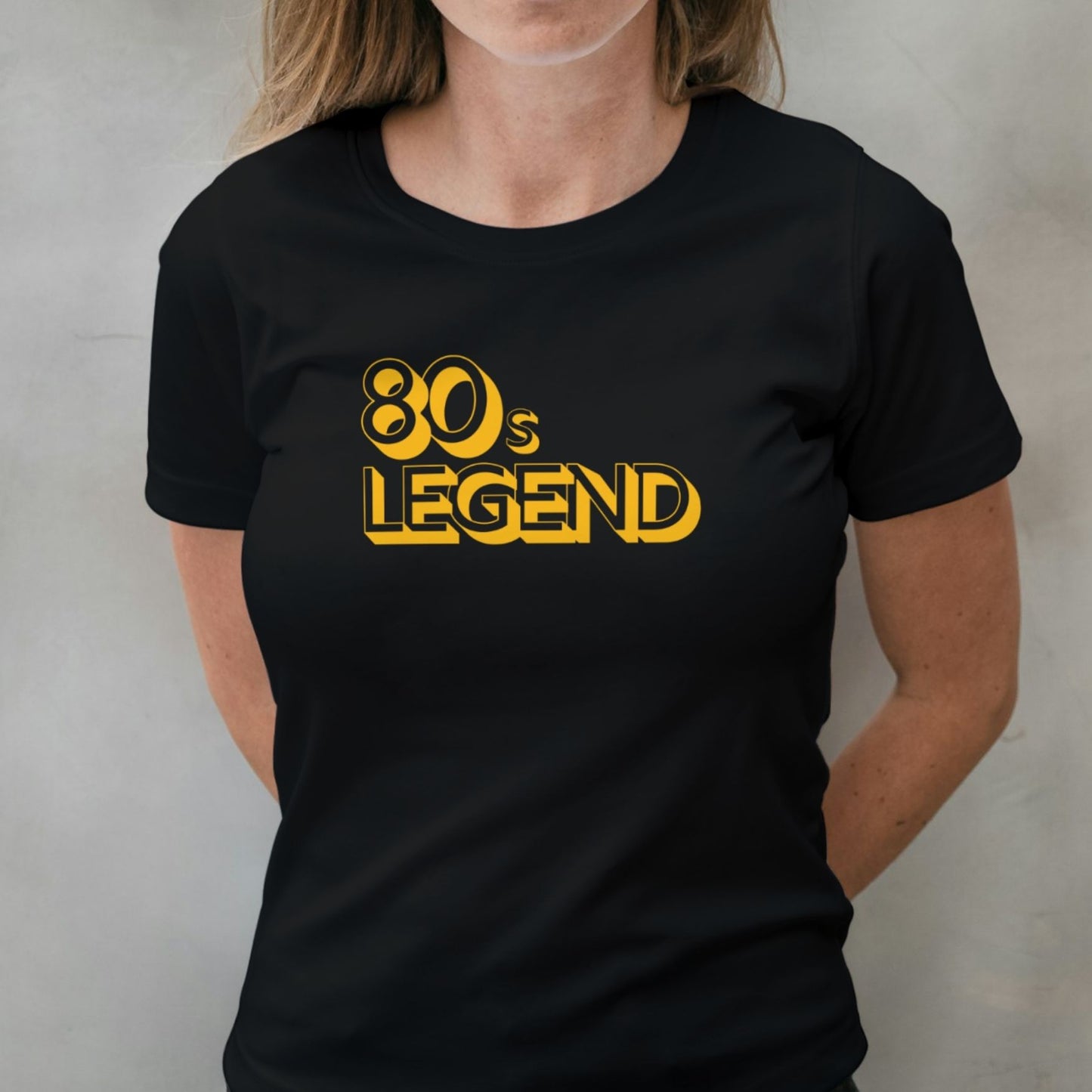 woman wearing 80s legend graphic tee