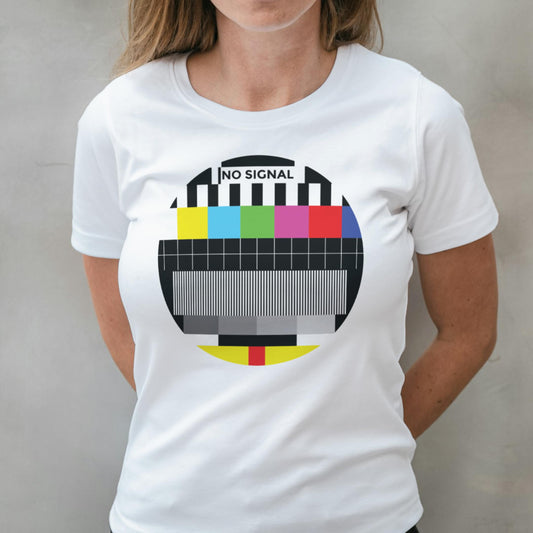 Person wearing a white t-shirt with a 'No Signal' test pattern design.