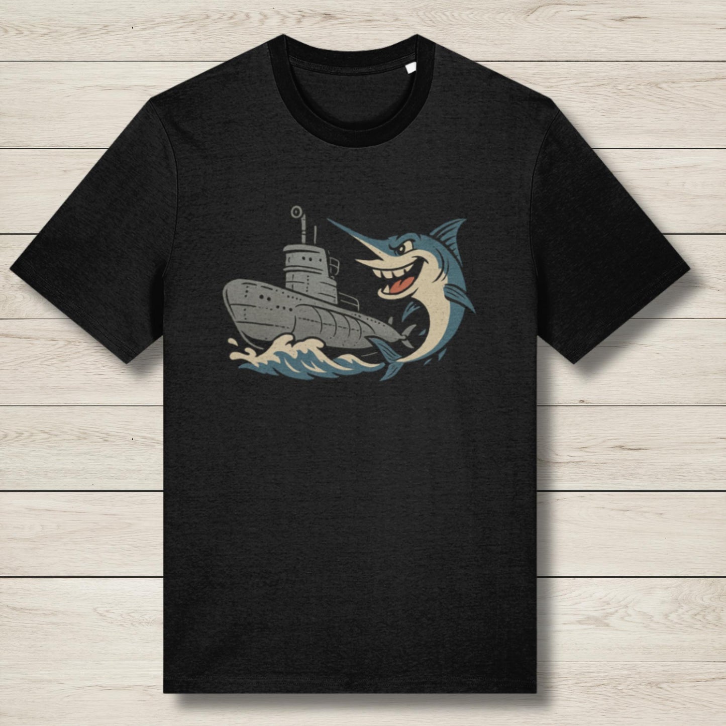 Black t-shirt with a graphic of a fish and a ship on a wooden surface