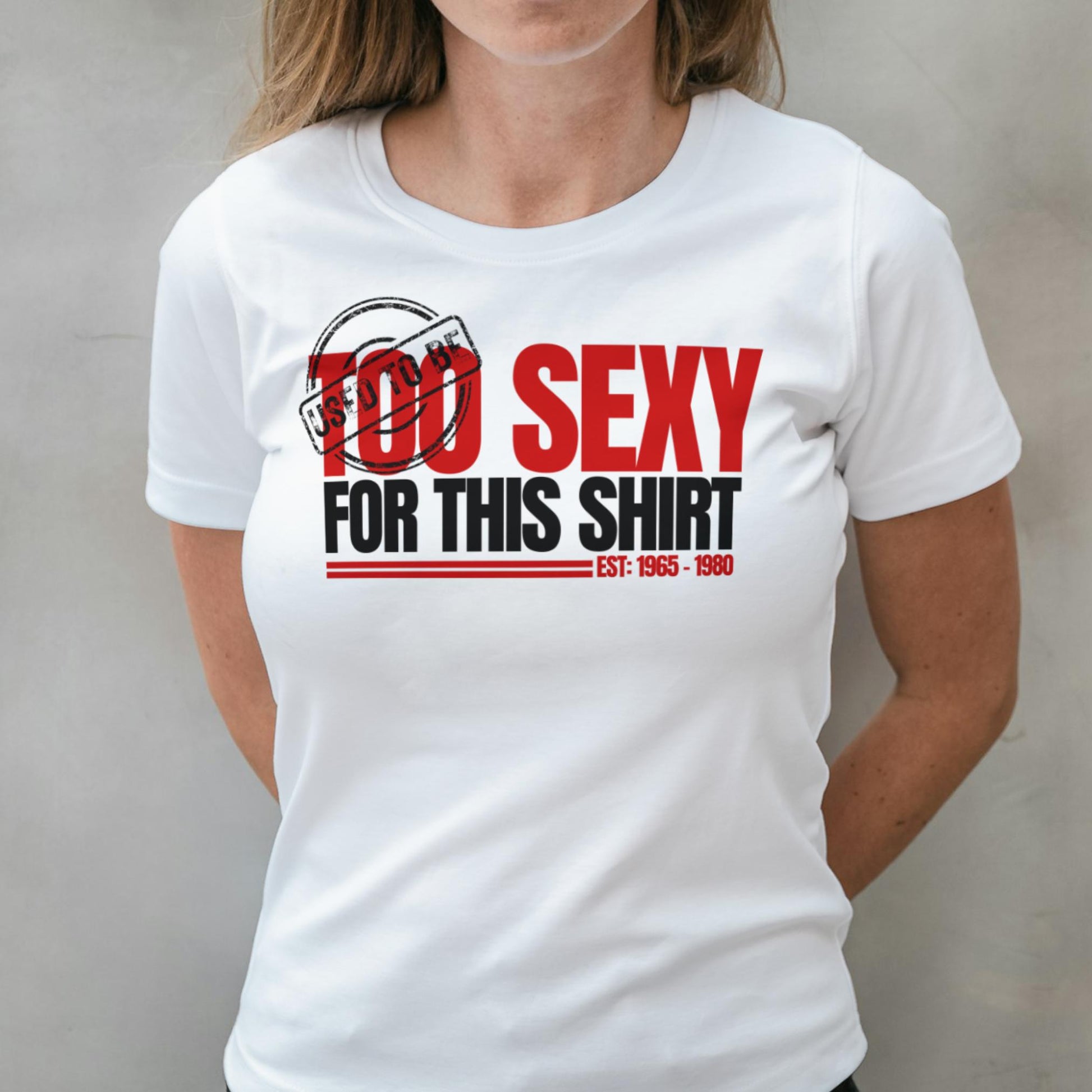 White t-shirt with red and black text design worn by a person against a plain background