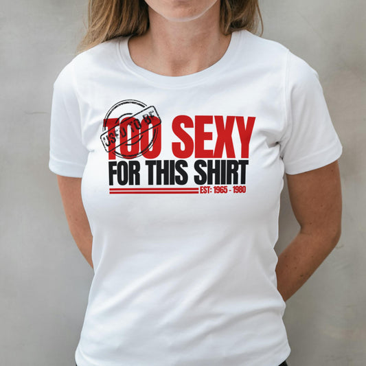 White t-shirt with red and black text design worn by a person against a plain background