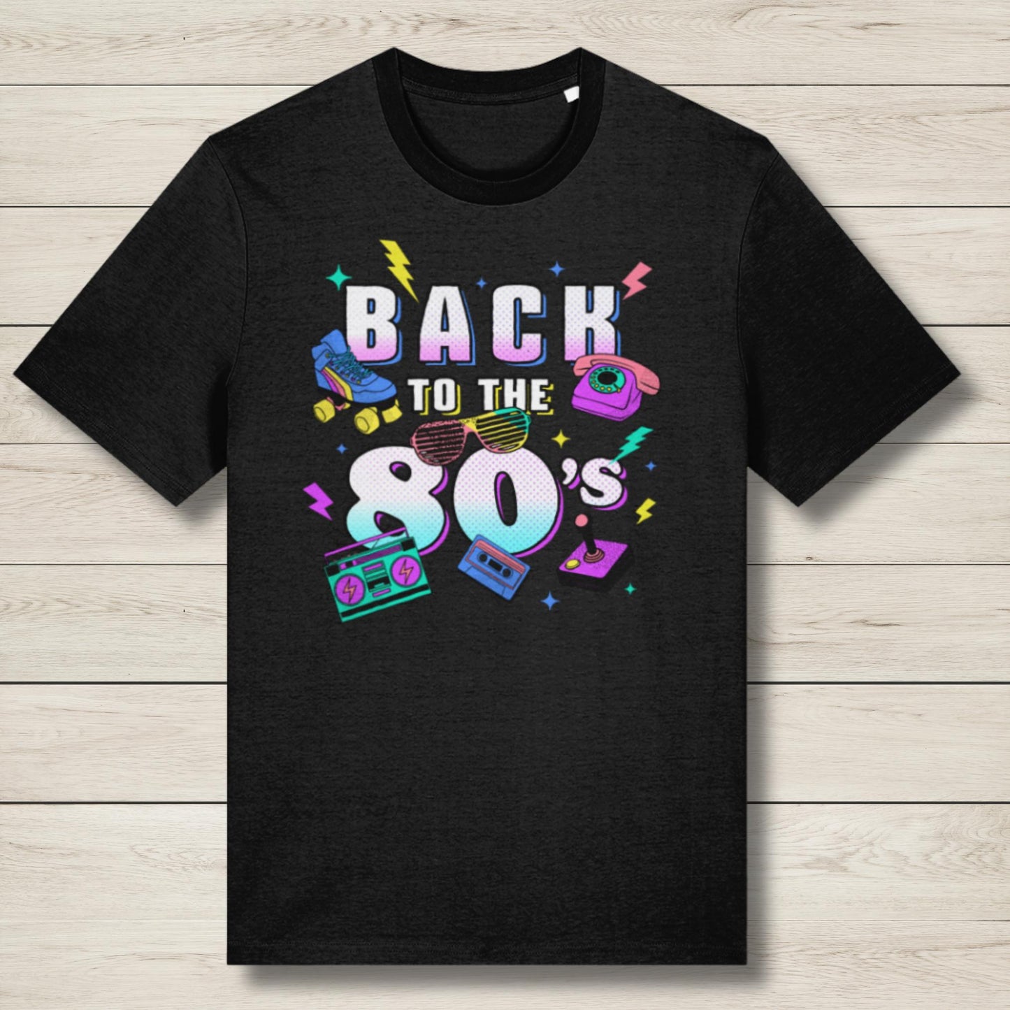 Black t-shirt with 'Back to the 80's' design on a wooden surface