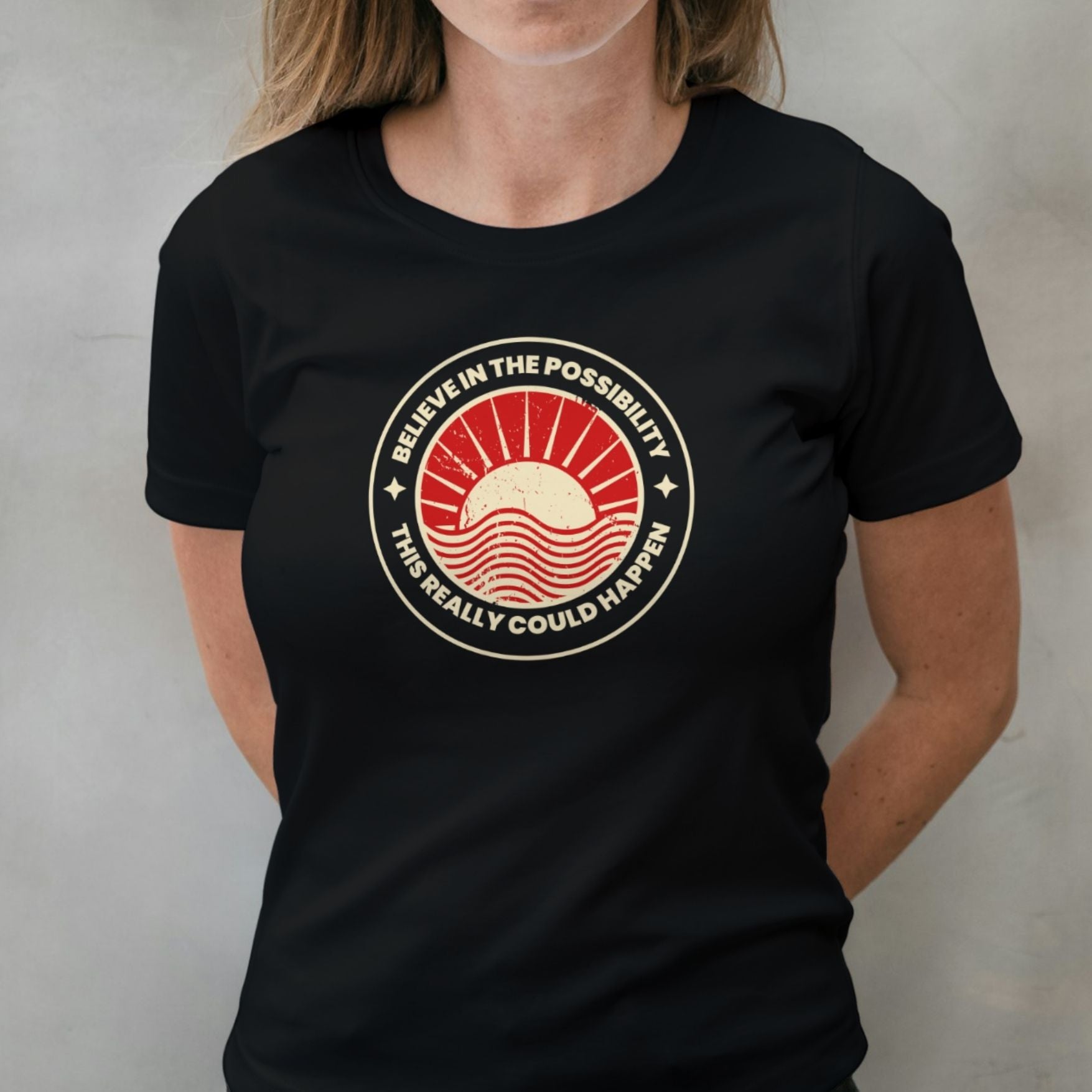 woman wearing believe in the possibility graphic tee