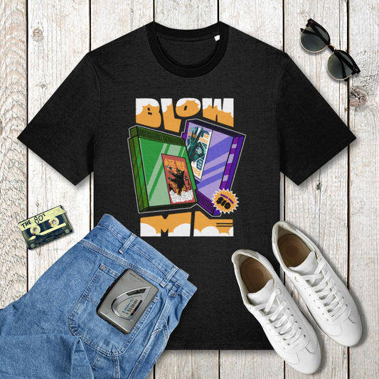 Black t-shirt with graphic design on a wooden surface with jeans, sneakers, and sunglasses.