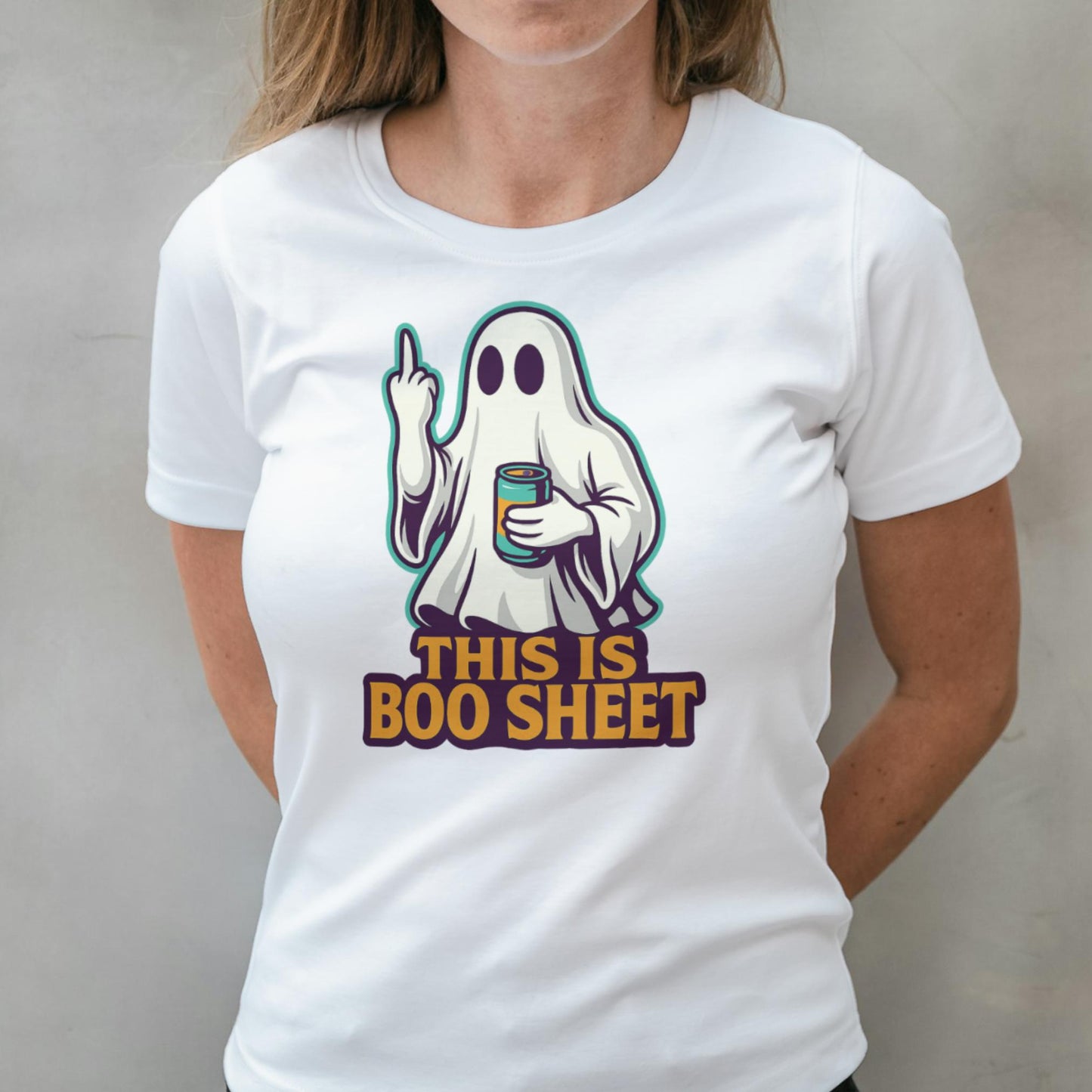 White t-shirt with a ghost graphic and text 'This is boo sheet' worn by a person.
