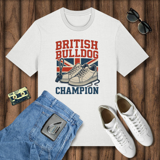 White t-shirt with 'British Bulldog Champion' design on a wooden surface with jeans, sneakers, and sunglasses.