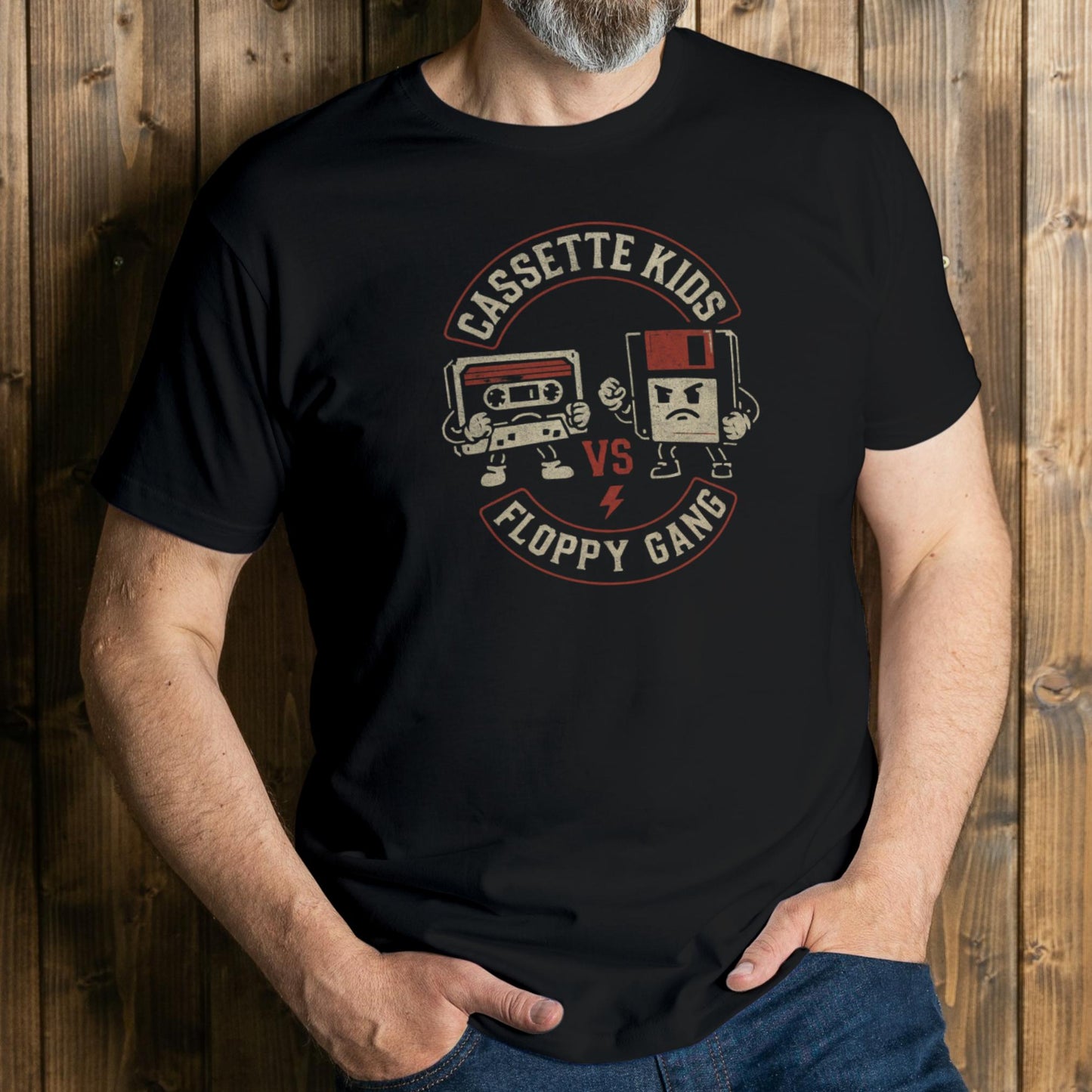 Person wearing a black t-shirt with a graphic design on a wooden background