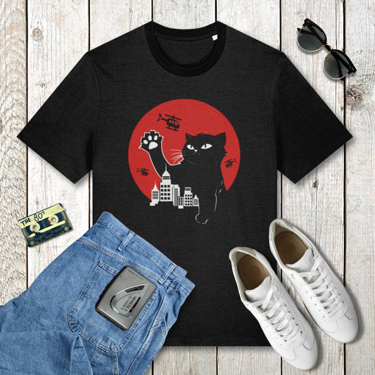 Black t-shirt with a cat graphic on a wooden surface with jeans, sneakers, and sunglasses.