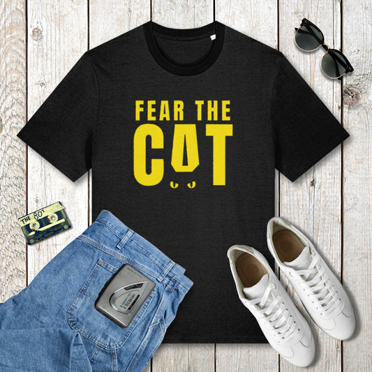 Black t-shirt with 'Fear the Cat' text, blue jeans, white sneakers, and sunglasses on a wooden surface.