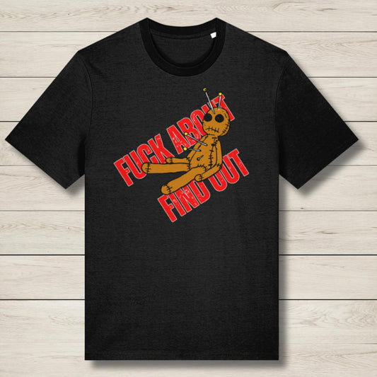 Black t-shirt with a graphic design featuring text and an alien figure on a wooden surface.