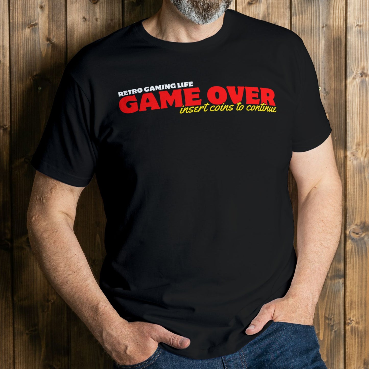 man wearing game over insert coins to continue t shirt
