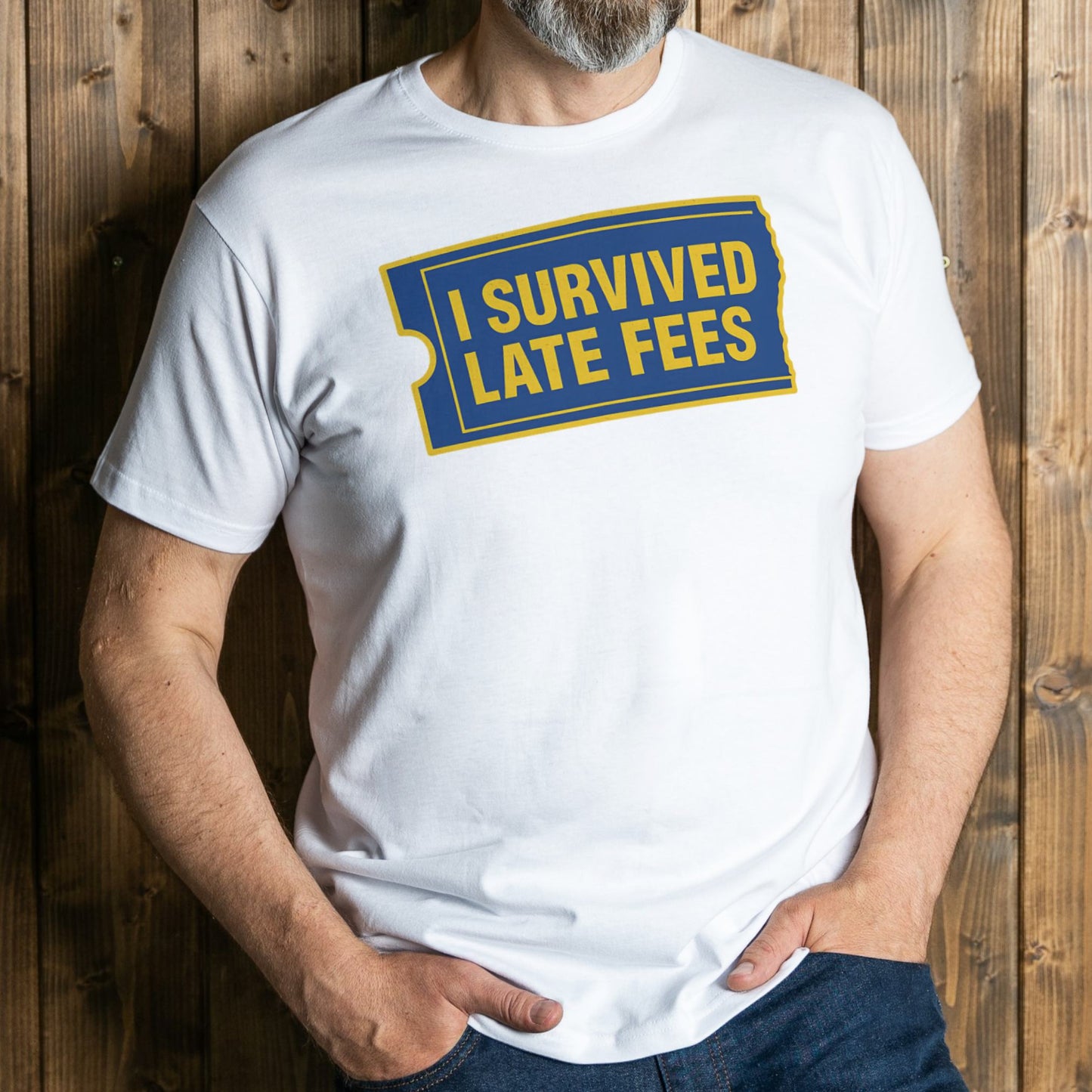 Person wearing a white t-shirt with 'I Survived Late Fees' text design on a wooden background