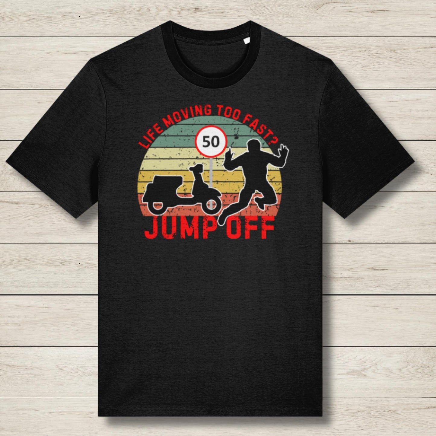 Black t-shirt with graphic design and text on a wooden surface