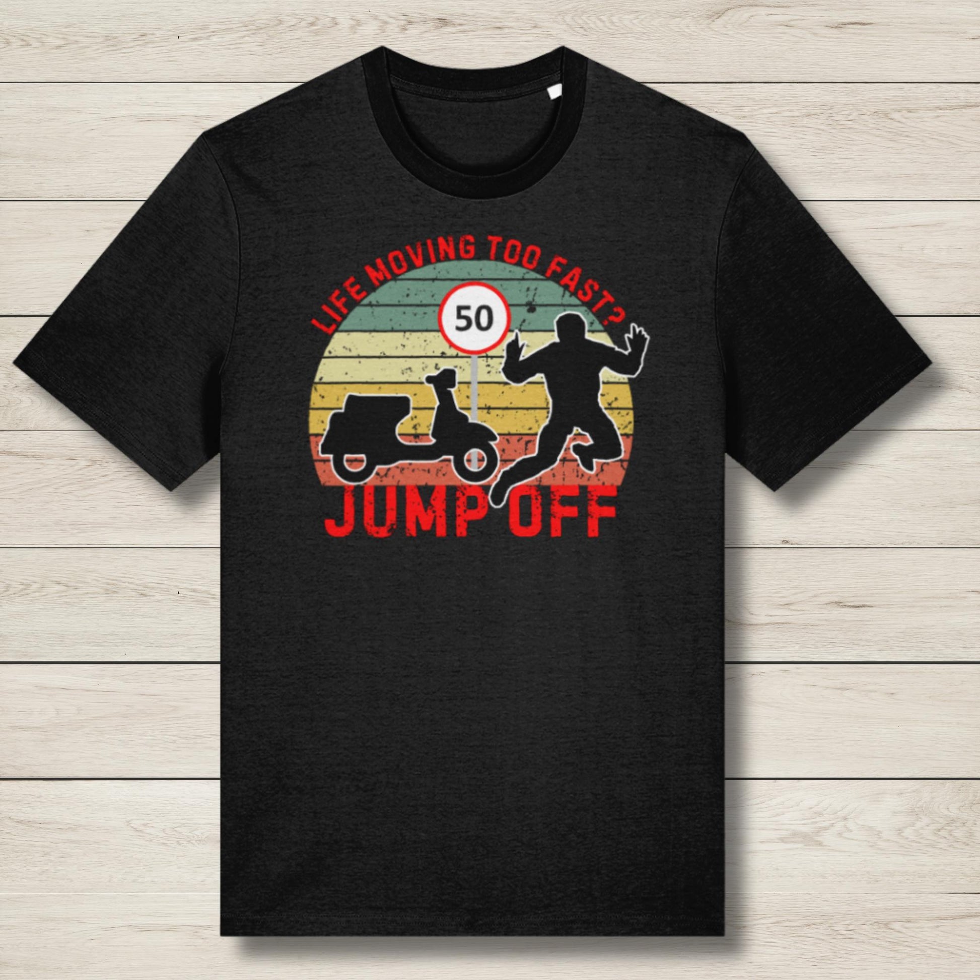 Black t-shirt with graphic design and text on a wooden surface