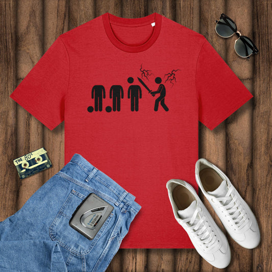 Red t-shirt with graphic design, blue jeans, white sneakers, and sunglasses on a wooden surface