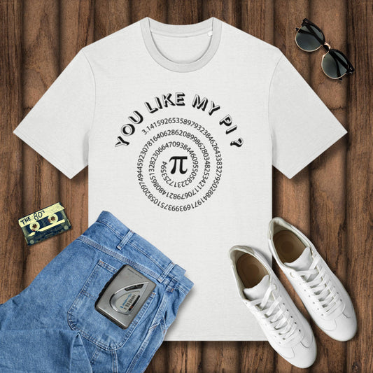 White t-shirt with 'You Like My Pi?' design on a wooden surface with jeans, sneakers, and sunglasses.