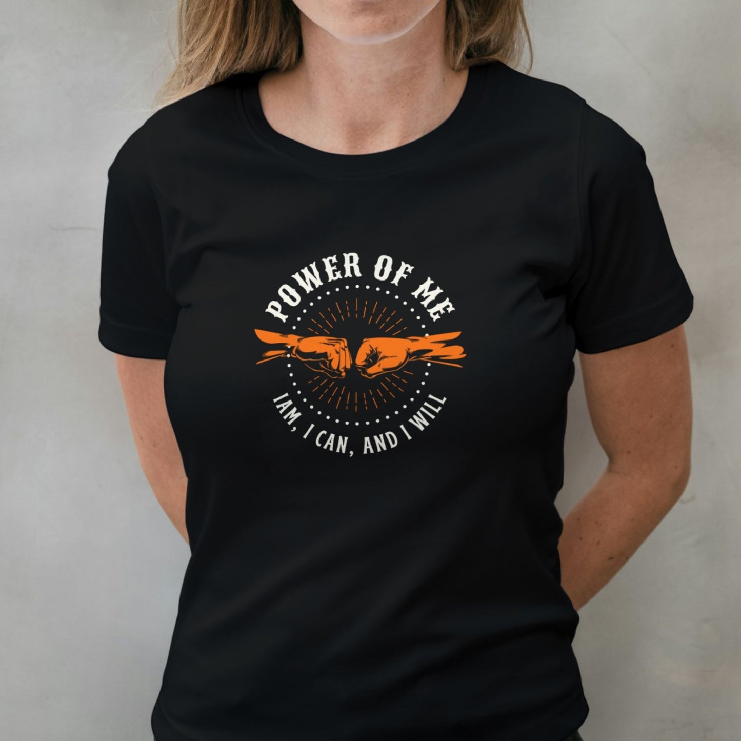 woman wearing power of me fist bump graphic tee