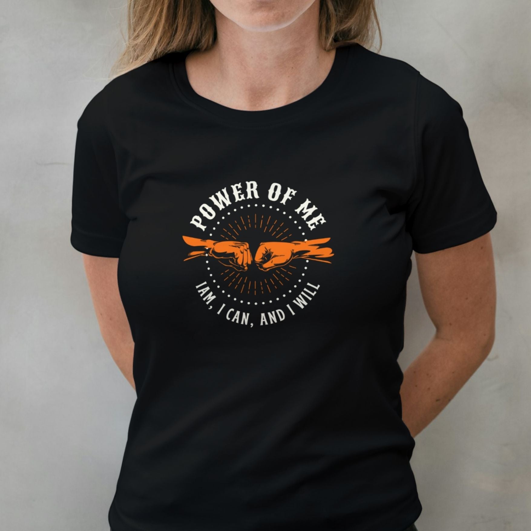 woman wearing power of me fist bump graphic tee