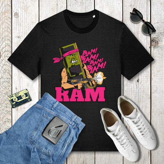 Black t-shirt with graphic design and casual items on a wooden surface