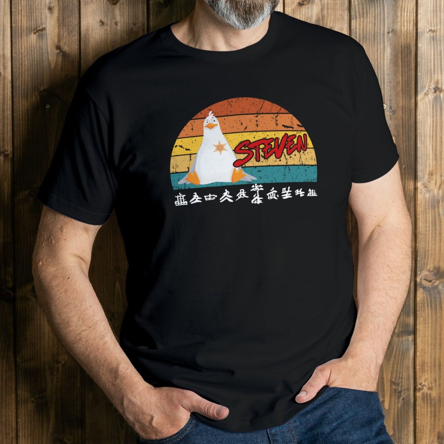 man wearing steven seagull graphic tee