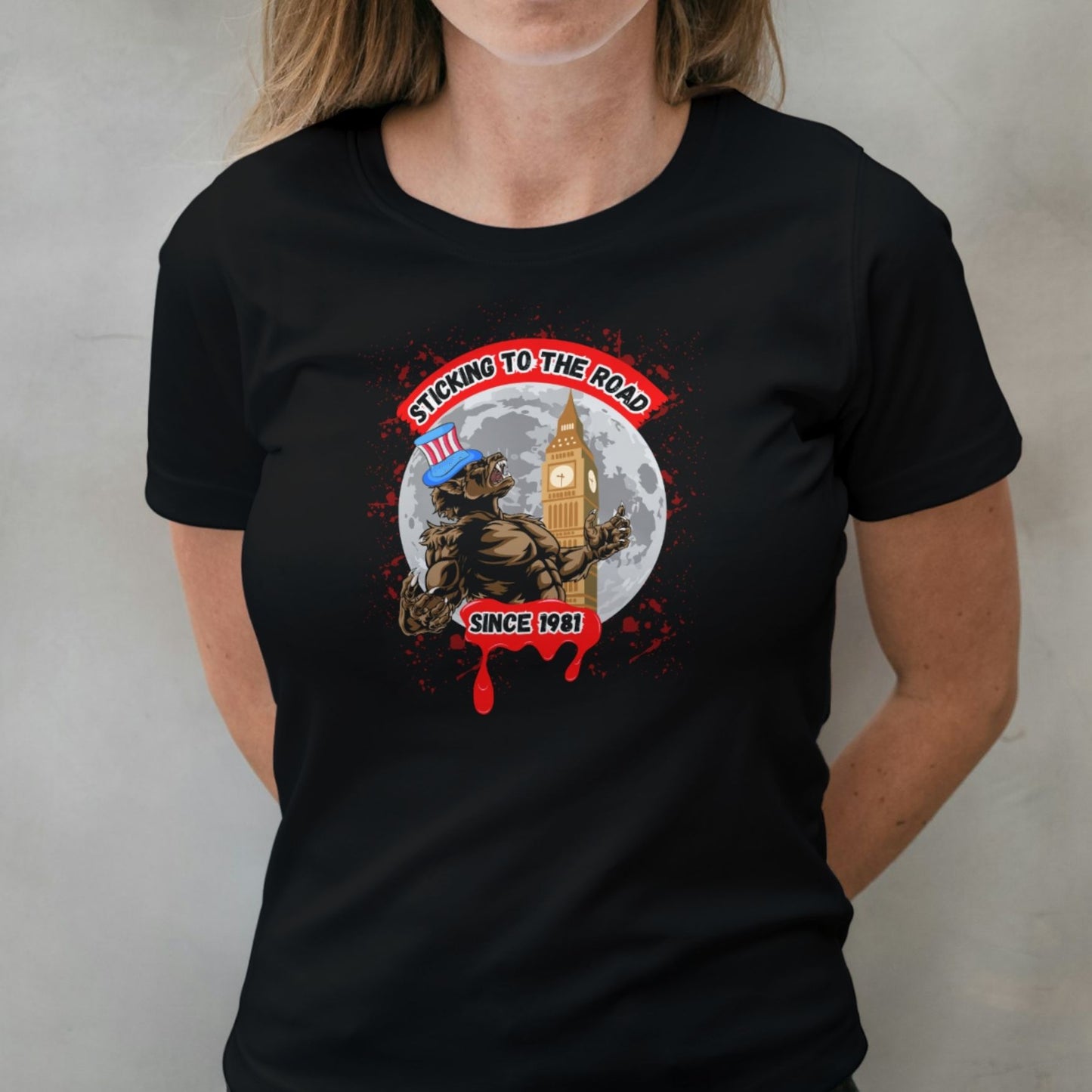 woman wearing sticking to the road graphic tee