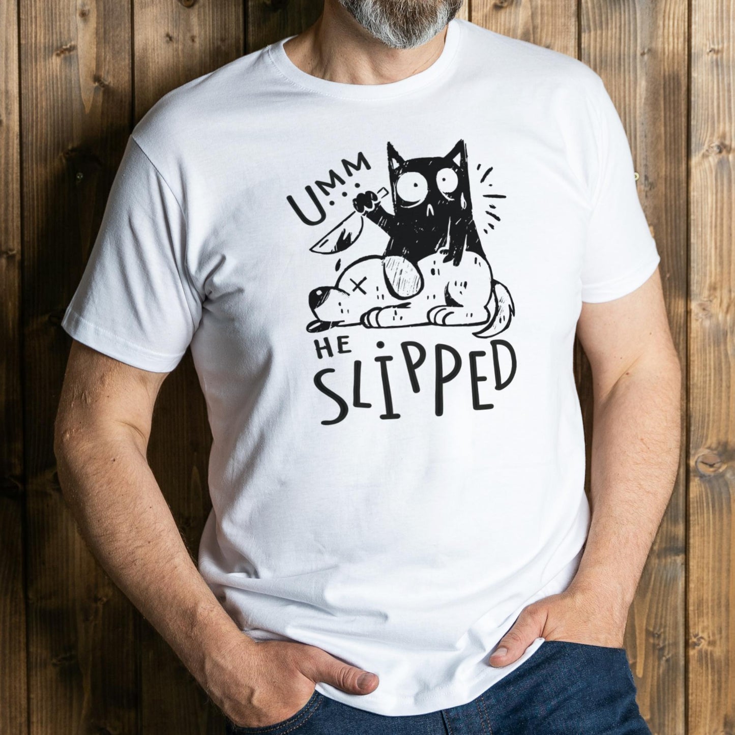 Person wearing a white t-shirt with a black graphic design and text against a wooden background