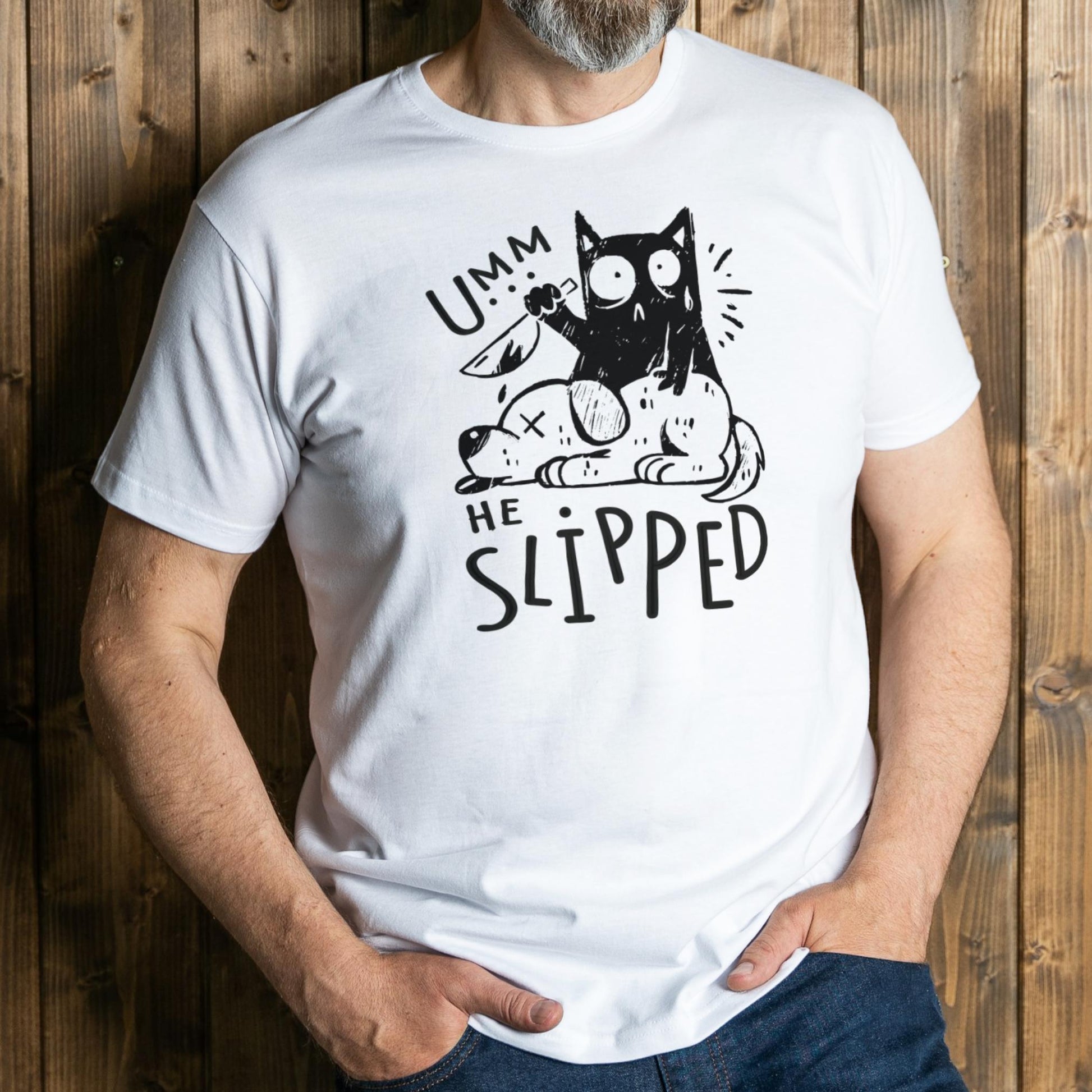 Person wearing a white t-shirt with a black graphic design and text against a wooden background