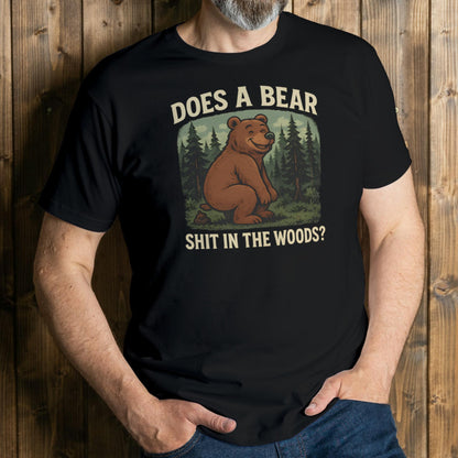 Person wearing a black t-shirt with a bear graphic and text against a wooden background