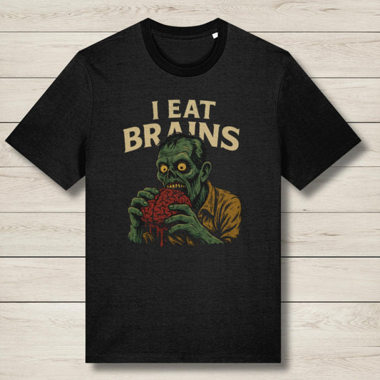 Black t-shirt with a graphic of a zombie holding a brain and 'I Eat Brains' text on a wooden surface.