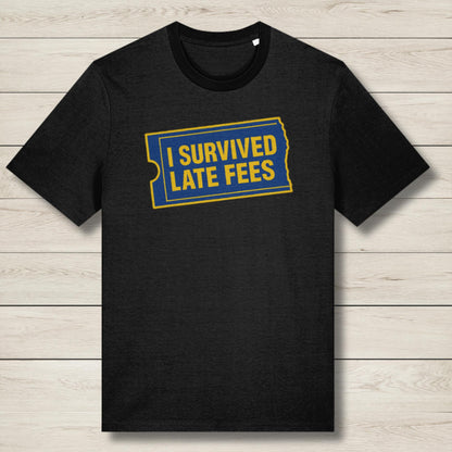 Black t-shirt with 'I Survived Late Fees' text on a wooden surface