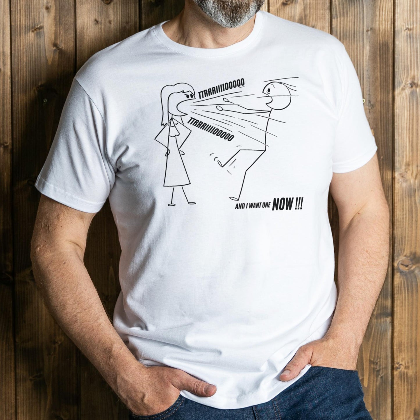 Person wearing a white t-shirt with a graphic design and text against a wooden background