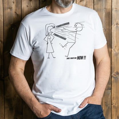 Person wearing a white t-shirt with a graphic design and text against a wooden background