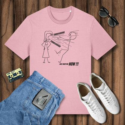 Pink t-shirt with graphic design on a wooden surface, surrounded by jeans, sneakers, sunglasses, and a cassette tape.