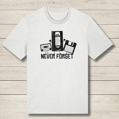 White t-shirt with retro technology graphic and 'Never Forget' text on a wooden surface