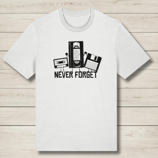 White t-shirt with retro technology graphic and 'Never Forget' text on a wooden surface