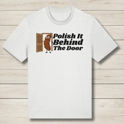White t-shirt with a graphic design and text on a wooden surface