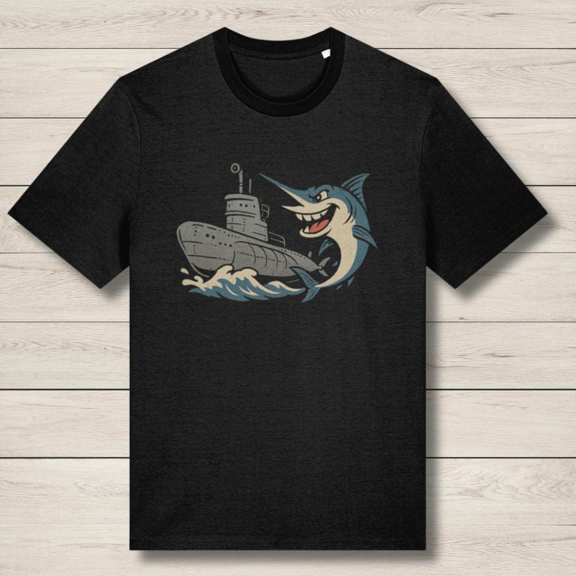 Black t-shirt with a graphic of a fish and a ship on a wooden surface