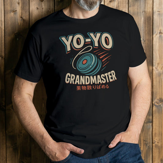 Person wearing a black t-shirt with 'YO-YO GRANDMASTER' design against a wooden background