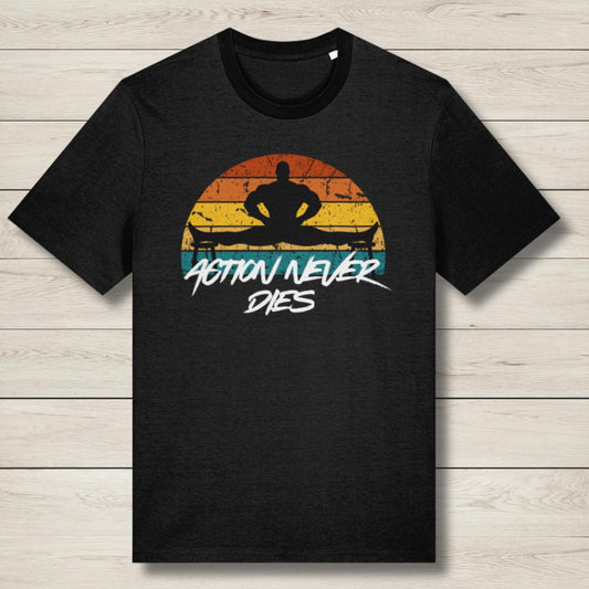 Black t-shirt with a graphic design of a silhouette and 'Action Never Dies' text on a wooden surface