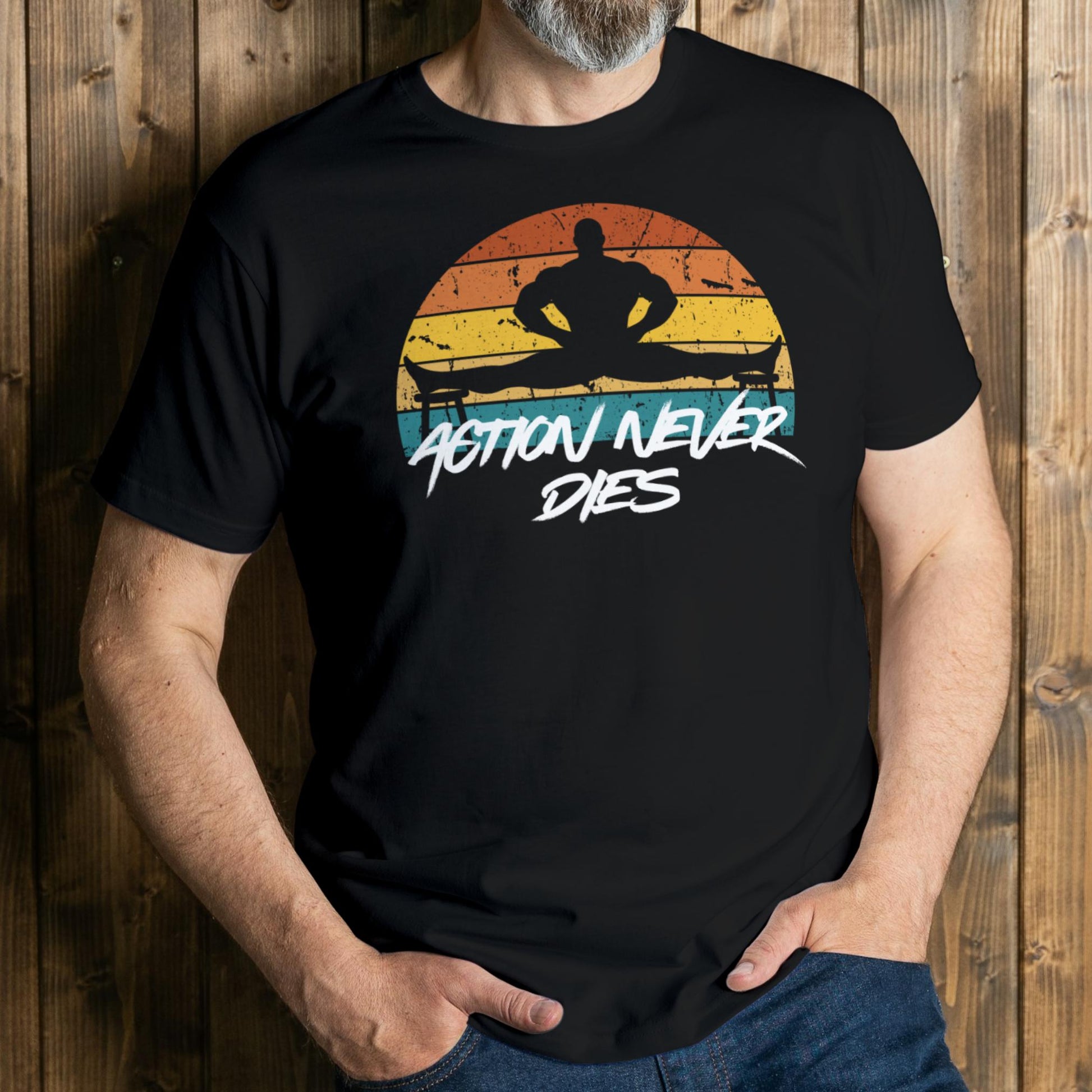 Person wearing a black t-shirt with a graphic design and text against a wooden background