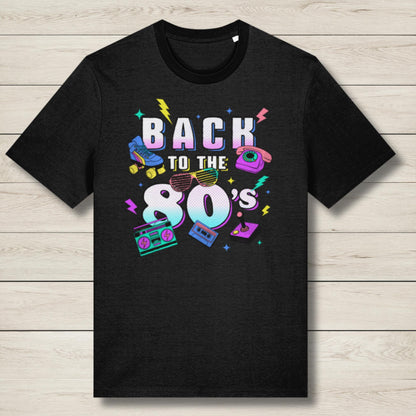 Black t-shirt with 'Back to the 80's' design on a wooden surface