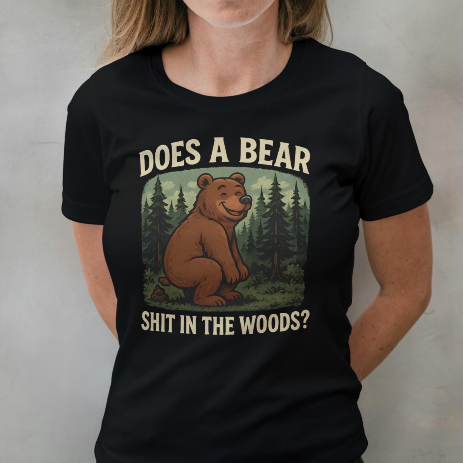Black t-shirt with bear graphic and text worn by a person against a plain background