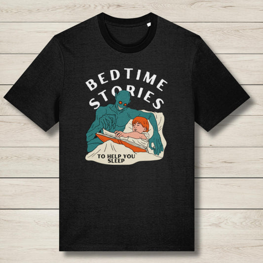 Black t-shirt with graphic of a creature reading to a child and text 'Bedtime Stories to Help You Sleep' on a wooden surface.