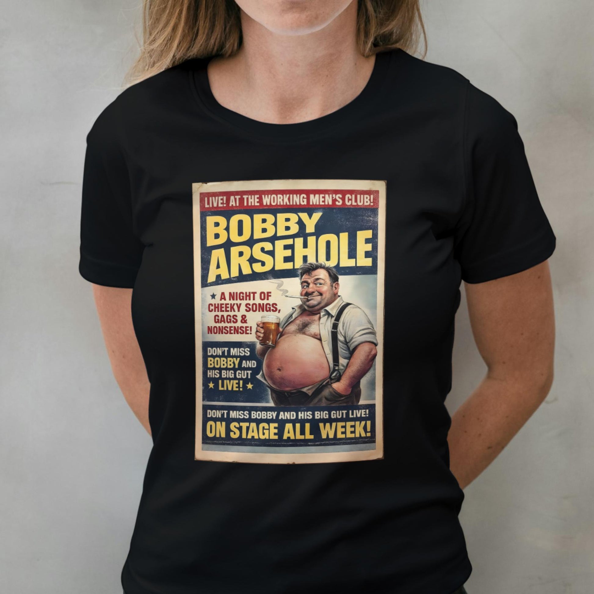 Person wearing a black t-shirt with a graphic design featuring a man and text.