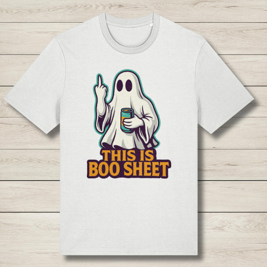 White t-shirt with a ghost graphic and text on a wooden surface