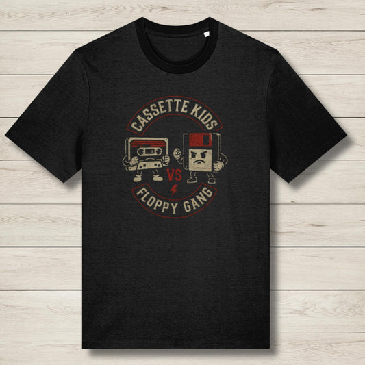 Black t-shirt with 'Cassette Kids vs Floppy Gang' graphic on a wooden surface